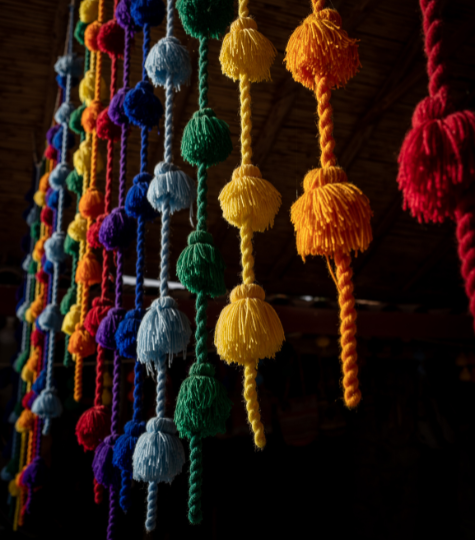 Coloured wool strings in a Chinchero shop front, Peru - GapGuru