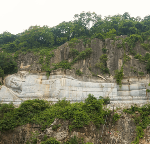 buddha carved into mountaain